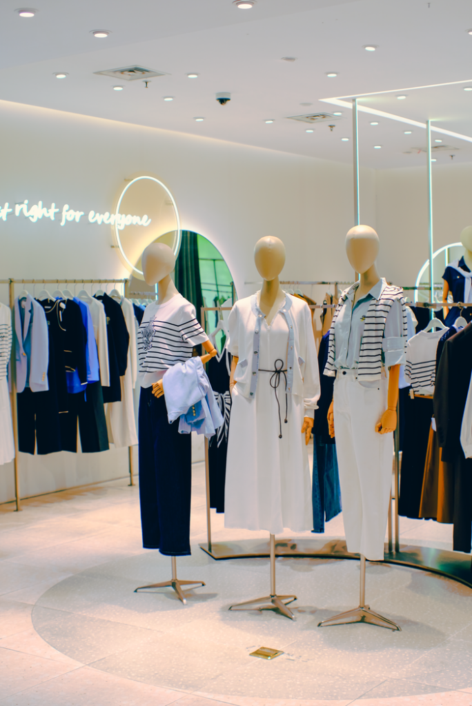 Chic clothing store interior with stylish mannequins. Elegant fashion display for retail inspiration.